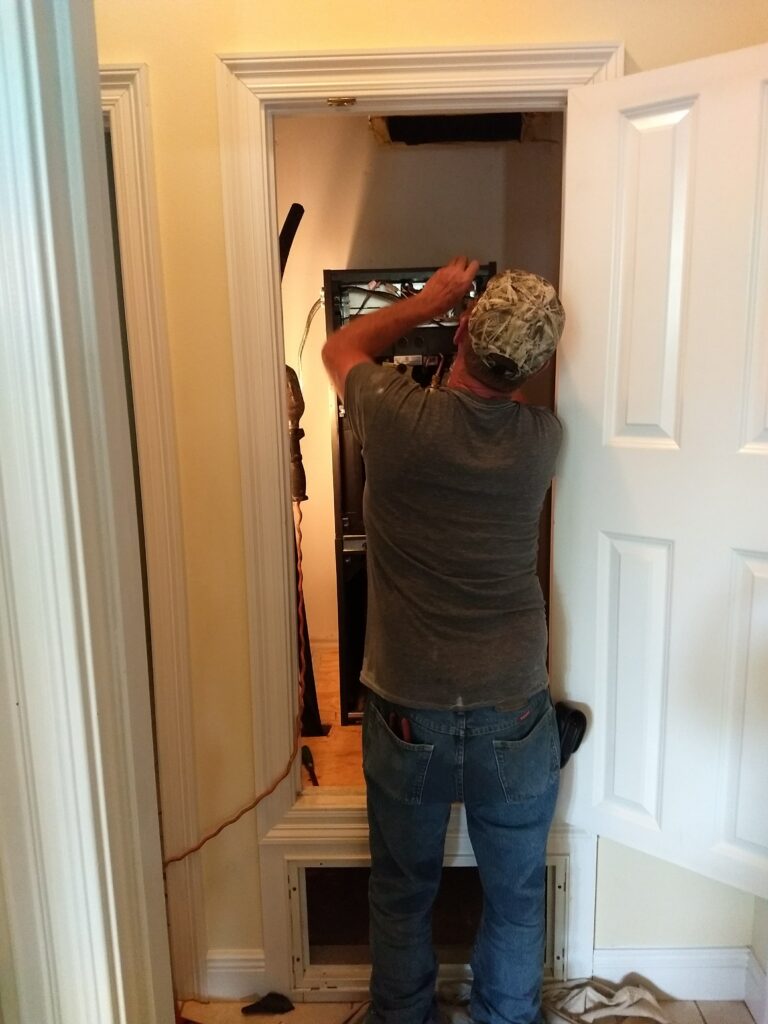 Indoor utility area with HVAC or water heating equipment