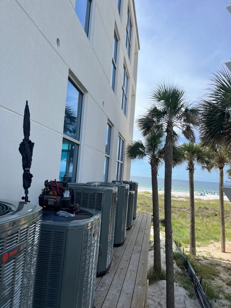 Commercial building exterior with utility equipment and fencing