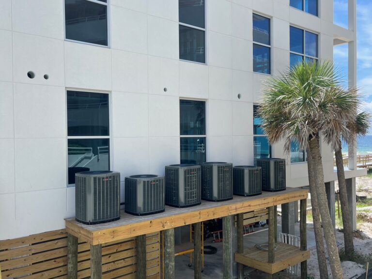 Exterior of a commercial building with landscaping and palm trees