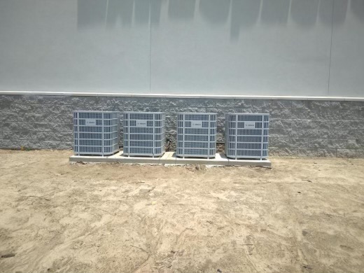 Rooftop HVAC units on a flat commercial roof